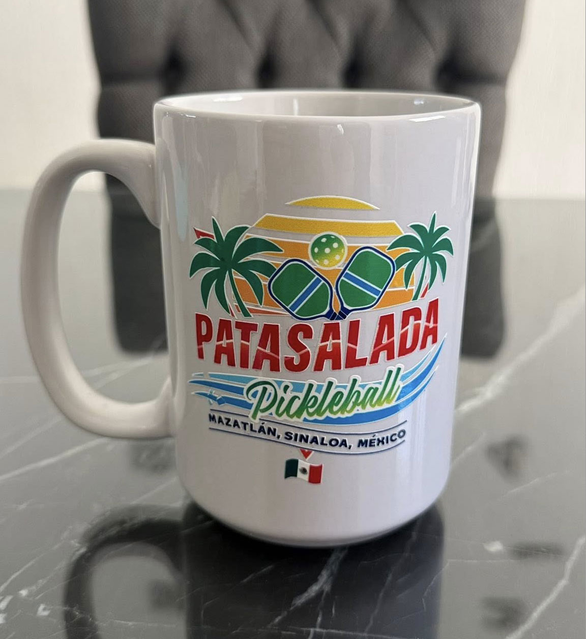 Pata Salada Mazatlán Pickleball Club branded coffee mug with colorful tropical logo.